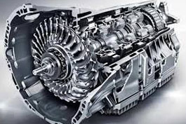 Cutaway view of a complex automotive engine, showcasing intricate components including a turbine and gearbox assembly.